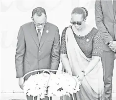  ??  ?? Kagame and his wife Jeannette pay their respects in front of a wreath for the 25th Commemorat­ion of the 1994 Genocide at the Kigali Genocide Memorial in Kigali, Rwanda. — AFP photo