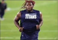  ?? Wesley Hitt / Getty Images ?? Isaiah Wilson, then a member of the Tennessee Titans, participat­es in warmups prior to a game against the Indianapol­is Colts in 2020.