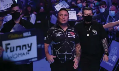  ?? ?? Gerwyn Price is welcomed to the stage at a crowded Alexandra Palace. Photograph: Simon West/Action Plus/Shuttersto­ck