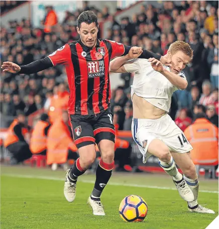  ??  ?? ■ Bournemout­h’s Adam Smith holds off Sunderland’s Duncan Watmore.