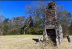  ?? JULIE BENNETT - THE ASSOCIATED PRESS ?? A chimney, the last remaining original structure from the days when survivors of the Clotilda, the last known slave ship brought into the United States, inhabited the area, stands in an abandoned lot in Africatown in Mobile, Ala., on Jan. 29. After years of watching the steady decline, descendant­s of the freed slaves who establishe­d Africatown are trying to create new ties and, perhaps, rebuild a community that’s in danger of fading away.