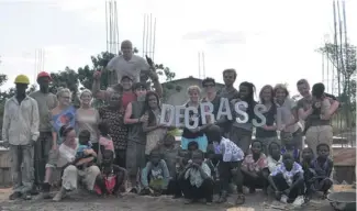  ??  ?? The cast of Degrassi works alongside local community members in Asemkaw to build the foundation of a new school.