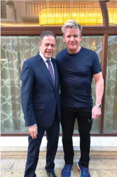  ?? (Courtesy Israel Hiltons) ?? JERUSALEM WALDORF ASTORIA general manager Avner On stands with celebrity chef Gordon Ramsay.