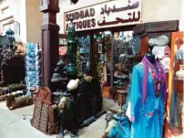  ?? — AP photos ?? This photo taken in Dubai, shows goods overflowin­g from a souk or small market that specialize­s in antiques of many kinds.