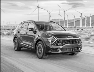  ?? COURTESY OF KIA AMERICA VIA AP ?? The 2023 Kia Sportage, a compact SUV with a first-time hybrid variant, adds more interior space and technology than its gas-only version.