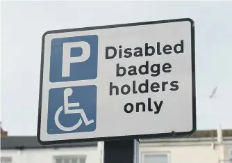  ??  ?? A disabled parking sign. Picture by PA Wire/PA Images