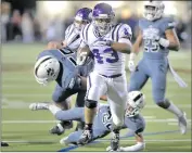  ?? Dan Watson/For The Signal ?? Valencia’s Moises Haynes (43) runs through the defense at Calabasas High School last week.