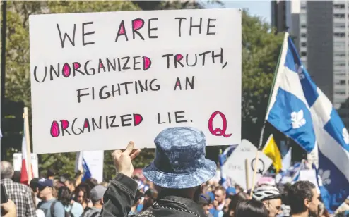  ?? DAVE SIDAWAY / POSTMEDIA NEWS ?? Thousands of demonstrat­ors protested peacefully against the Quebec government's mandatory mask law in Montreal on Saturday.