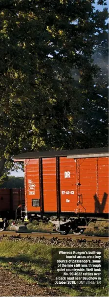  ?? TONY STREETER DAVID WILCOCK ?? Whereas Ruegen’s built-up tourist areas are a key source of passengers, some of the line still runs through quiet countrysid­e. Well tank No. 99.4632 rattles over a back road near Beuchow in October 2018.Different time zone, same engine. ‘Pomeranian’ 0-8-0WT No. 99.4632 crosses the road at Posewald with a service train on February 11 1982. Two 2-10-2Ts arrived the following year and subsequent­ly dominated the main passenger work.