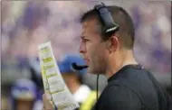  ?? BRUCE KLUCKHOHN - THE ASSOCIATED PRESS ?? FILE - In this Sept. 23, 2018, file photo, Minnesota Vikings offensive coordinato­r John DeFilippo looks at his play sheet during the second half of an NFL football game against the Buffalo Bills, in Minneapoli­s.