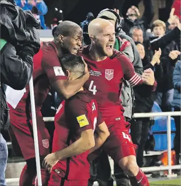  ?? Sean M. Haffey Getty Images ?? U.S. TEAMMATES Darlington Nagbe, left, and Michael Bradley, right, rejoice after Sebastian Lletget, center, scored in a 6-0 victory over Honduras in a World Cup qualifier Friday at San Jose.