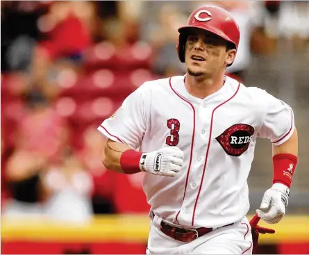  ?? DAVID JABLONSKI / STAFF ?? Reds second baseman Scooter Gennett leads the NL with a .331 batting average and ranks seventh in RBIs (57). Gennett, who likely will draw trade interest before the deadline, has turned into a fan favorite and an All-Star-caliber player in his second season with the Reds.