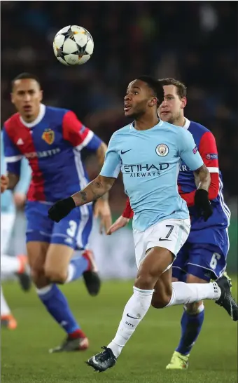  ??  ?? Raheem Sterling of Manchester City keeps his eyes on the ball during their hammering of Basel.