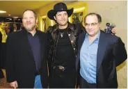  ?? Chris Pizzello / Associated Press 2005 ?? “Sin City” co-director Robert Rodriguez poses between Harvey (left) and Bob Weinstein in 2005, when the brothers were running Miramax.