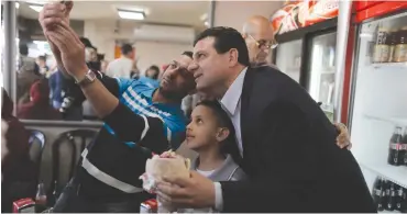  ?? (Ammar Awad/Reuters) ?? JOINT LIST HEAD Ayman Odeh poses for a photograph at a restaurant in Acre during his maiden campaign as party leader in 2015.