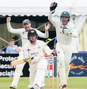  ??  ?? Ryan Higgins is caught behind in Gloucester­shire’s first innings Pictures: Nick Parford