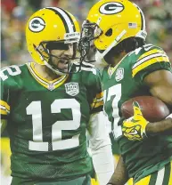  ?? DYLAN BUELL / GETTY IMAGES FILES ?? Aaron Rodgers and his favourite target, receiver Davante
Adams, celebrate after hooking up for a touchdown.