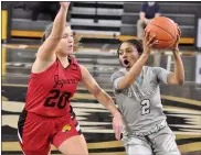  ?? DAN FENNER - FOR MEDIANEWS GROUP ?? Oakland University’s Lamariyee Williams (2) looks to make a break to the basket as IUPUI’s Agatha Beier (20) defends closely on Tuesday at the O’rena in Rochester.
