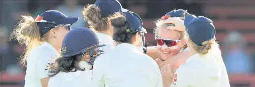  ?? Mark Evans ?? Teenager Sophie Ecclestone is the centre of attention after taking a wicket for England in the Ashes Test with Australia in Sydney last Friday – and her local club, Alvanley, have been celebratin­g her great success too. See Page 50 for full story.