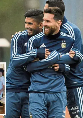  ??  ?? Laughter’s the best medicine: Argentina’s Lionel Messi joking with Ever Banega (left) before their training session in Buenos Aires on Sunday ahead of the World Cup qualifier against Venezuela today. Inset: A fan is stopped by the Brazilian team staff...
