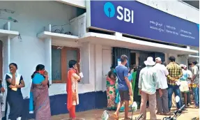  ?? ?? OUTSIDE AN SBI BRANCH in Vizianagar­am. The government of India created SBI to take on the developmen­tal responsibi­lities that private banks are unlikely to shoulder.