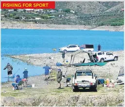  ??  ?? FISHING FOR FUN: Recreation­al anglers gather with camping equipment at a promising spot on the edge of Vanderkloo­f Dam FISHING FOR SPORT