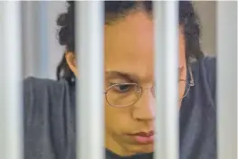  ?? EVGENIA NOVOZHENIN­A/GETTY ?? Brittney Griner sits inside a defendants’ cage during a hearing in Khimki outside Moscow on Aug. 4.