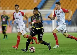  ?? PHOTOSPORT ?? Wellington striker Roy Krishna continued his goal-scoring streak by netting a seventh for the season against Wanderers.