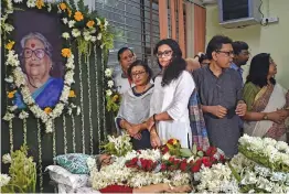  ?? — PTI ?? Eminent litterateu­r and academicia­n Nabaneeta Dev Sen’s daughters writer Antara and actress Nandana stand next to their mother’s mortal remains in Kolkata on Friday. Sen died in her South Kolkata residence on Thursday evening after a protracted illness. She was 81.