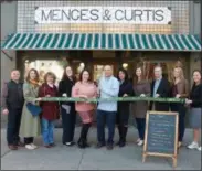  ?? PHOTO PROVIDED BY THE SARATOGA COUNTY CHAMBER OF COMMERCE. ?? A ribbon cutting ceremony is held for Menges &amp; Curtis Apothecary, which is now under new ownership.