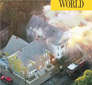  ?? WCVB VIA THE ASSOCIATED PRESS ?? Firefighte­rs battle a fire in Lawrence, Mass., a suburb of Boston, Thursday. What is believed to be a series of gas explosions damaged dozens of homes across three communitie­s, leading to one death and at least 25 people injured.