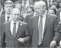  ?? Jorge Silva / Associated Press ?? Russian President Vladimir Putin said President Donald Trump behaved “with the highest level of goodwill and correctnes­s” at the APEC Summit in Danang, Vietnam. “He is a cultured person.”