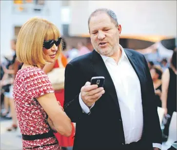  ?? Jemal Countess Getty Images for Conde Nast ?? ANNA WINTOUR, the editor of Vogue magazine, with Weinstein at an industry event at the Lincoln Center in New York in 2010. Wintour and other industry power players with ties to Weinstein have denounced him.