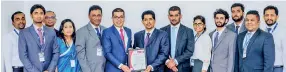  ??  ?? Boardpac Chief Operating Officer Rajitha Kuruppumul­le (Sixthfrom left) with General Manager Shan Nanayakkar­a and Bureau Veritas Sales and Marketing Manager Gayan Balachandr­a and representa­tives of the Boardpac ISO Committee at the presentati­on of the...