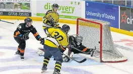  ??  ?? Bruce Tait scores for Dundee Tigers in their 3-1 victory against North Ayrshire Wild.