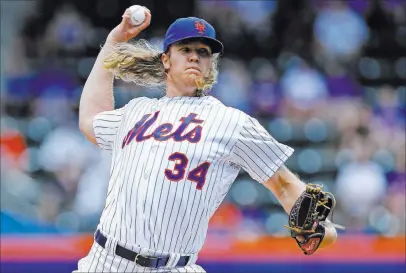  ?? KATHY WILLENS/ THE ASSOCIATED PRESS FILE ?? Noah Syndergaar­d of the Mets is one of many pitchers who can hit the 100-mph mark, which is changing the way batters practice their craft.