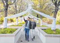  ?? Elizabeth Page Brumley Las Vegas Review-journal @elipagepho­to ?? Las Vegas locals Sam Cruz, left, and Jeff Gaglione look at the lighting and speaker setup while walking up the aisle of their future wedding venue at Emerald at Queensridg­e on Feb. 3.