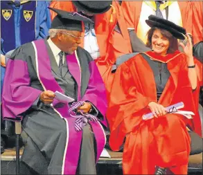  ??  ?? SPECIAL OCCASION: Professor Peter Mtuz, left, congratula­tes artist Professor Penny Siopis on her honorary doctorate at Rhodes University’s graduation ceremony yesterday