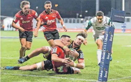  ??  ?? Talismanic: Ryan Crotty, seen here being tackled by Lachlan Boshier of the Chiefs, makes a welcome return to the Crusaders team this weekend as they take on the Bulls in Christchur­ch. Photo: Kai Schwoerer/Getty Images