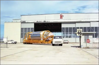  ?? The Associated Press ?? AREA 46: This Aug. 13, 1965, photo provided by the San Diego Air and Space Museum shows an Atlas Centaur 7 rocket carried by a truck at Cape Canaveral, Fla. NASA’s leading asteroid expert, Paul Chodas, speculates that asteroid 2020 SO, as it is formally known, is actually a Centaur upper rocket stage that propelled NASA’s Surveyor 2 lander to the moon in 1966 before it was discarded.