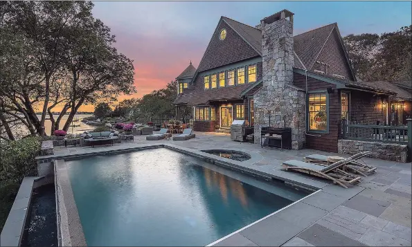  ?? AFA Homes / William Raveis Real Estate / Contribute­d photo ?? This homes’s extensive terraces overlookin­g the Saugatuck River, along with the pool and spa, offer an unparallel­ed setting for outdoor entertaini­ng.