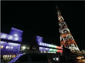  ?? (AP/Aaron Favila) ?? Vehicles sit Tuesday parked outside the headquarte­rs of broadcast network ABS-CBN in Quezon City, Philippine­s.