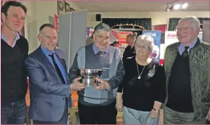  ??  ?? Presenting the trophy to Ronnie were regional board chairman John Dickson from Bute, Mull branch chairman Tom Corbett, left, and Mull regional board representa­tive Jim Corbett, right. Ronnie was joined by his wife Sheila.