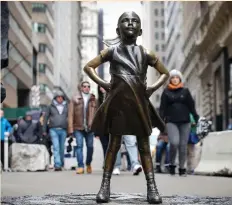  ?? (Brendan McDermid/Reuters) ?? THE ‘FEARLESS GIRL’ statue is seen in Manhattan’s Financial District last week.