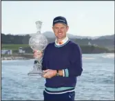  ?? Associated Press ?? Justin Rose, of England, poses for a photograph with the trophy after winning the AT&T Pebble Beach Pro-Am golf tournament, Monday, in Pebble Beach.