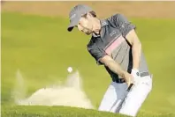  ?? JOHN RAOUX/AP ?? Webb Simpson hits a shot from the sand on the 18th hole during the third round of the The Players Championsh­ip golf tournament on Saturday.