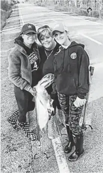  ?? CONTRIBUTE­D ?? Adele Cox, centre with friends Susan MacIntyre, left and Allison Pinhorn, on a 3.2-kilomtre section of the Port Morien highway named in memory of Adele's daughter Leigh-Anne Cox, who died of cancer in June 2020.