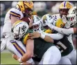  ?? MARK KEMPTON — FOR THE MORNING JOURNAL ?? The Medina defense swarms to the ball against Avon during the Bees’ non-conference victory Aug. 26 at Ken Dukes Stadium.