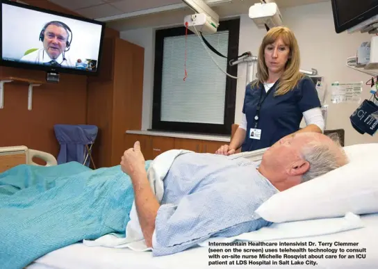  ??  ?? Intermount­ain Healthcare intensivis­t Dr. Terry Clemmer (seen on the screen) uses telehealth technology to consult with on-site nurse Michelle Rosqvist about care for an ICU patient at LDS Hospital in Salt Lake City.