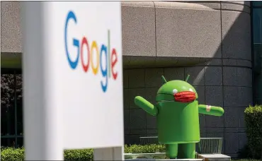  ?? DAVID PAUL MORRIS — BLOOMBERG ?? An Android statue wearing a mask on the Google campus in Mountain View, Calif.